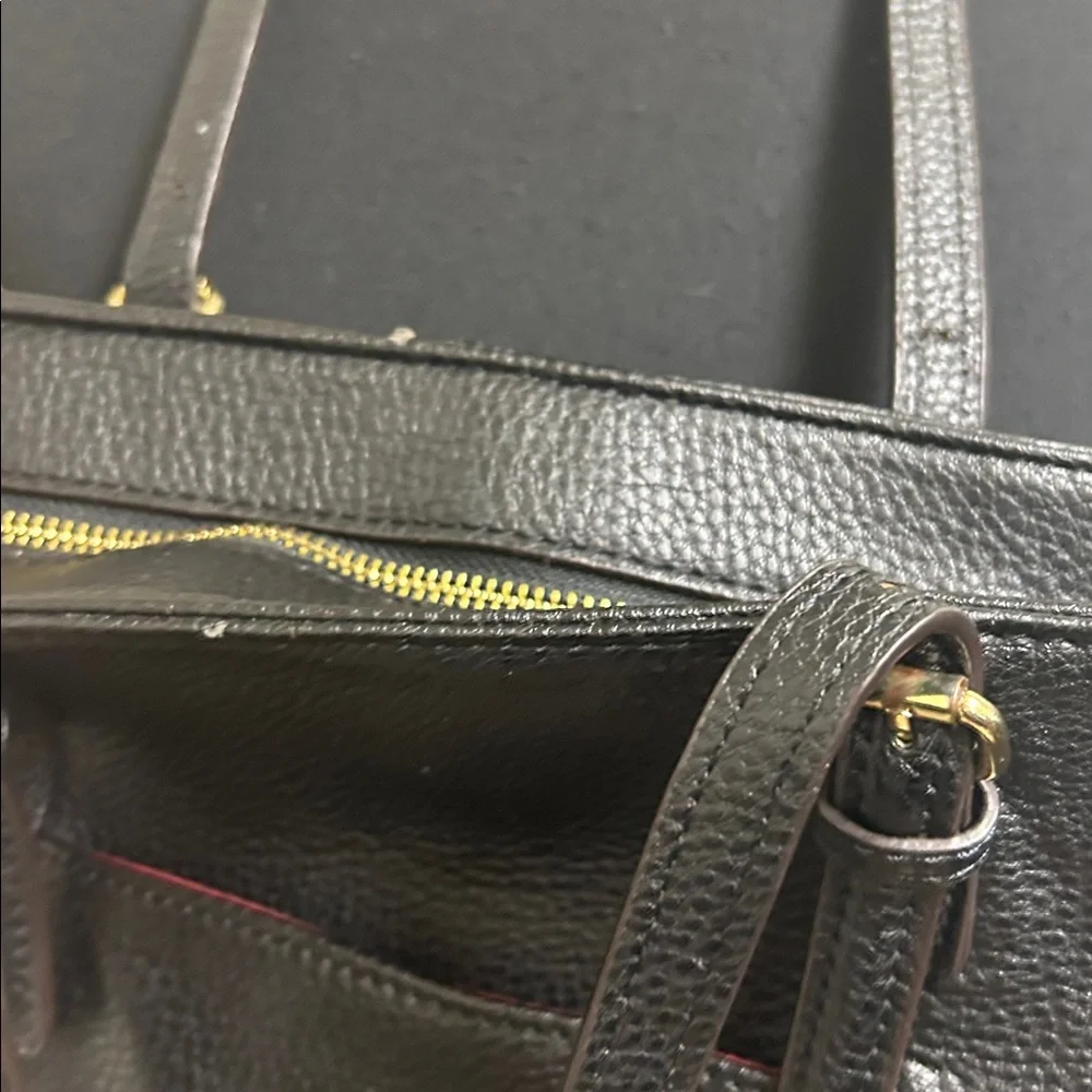 Anne Klein Black leather Tote with size pocket and adjustable straps. 13”x9 1/2”